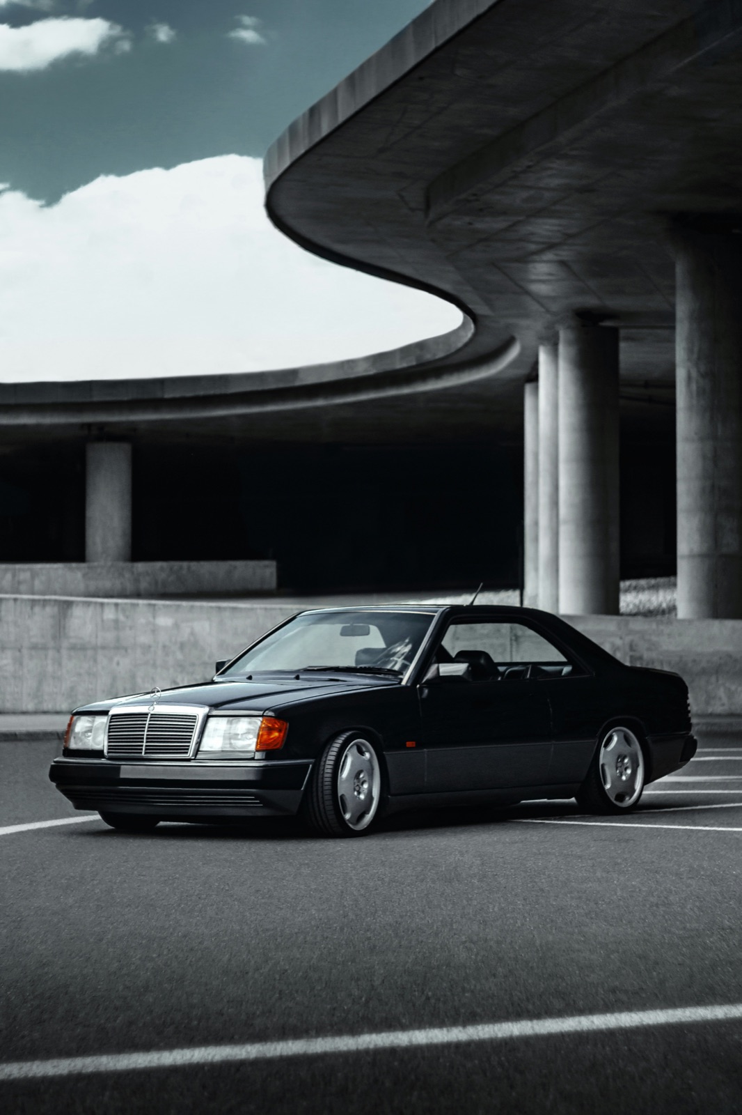 Mercedes-Benz W124 300CE Coupe in black, front three-quarter view