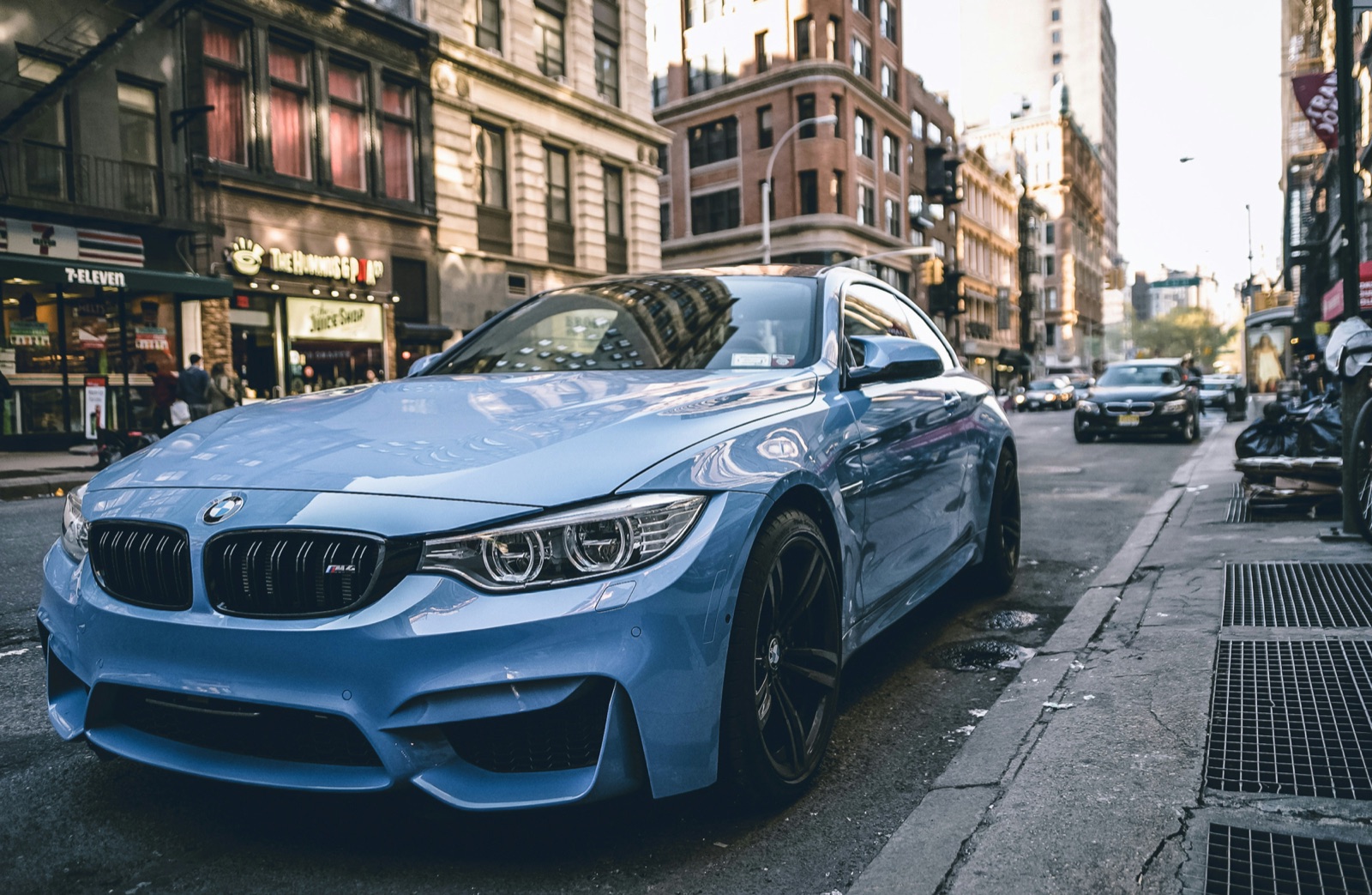 BMW M4 Competition in Yas Marina Blue, front three-quarter view